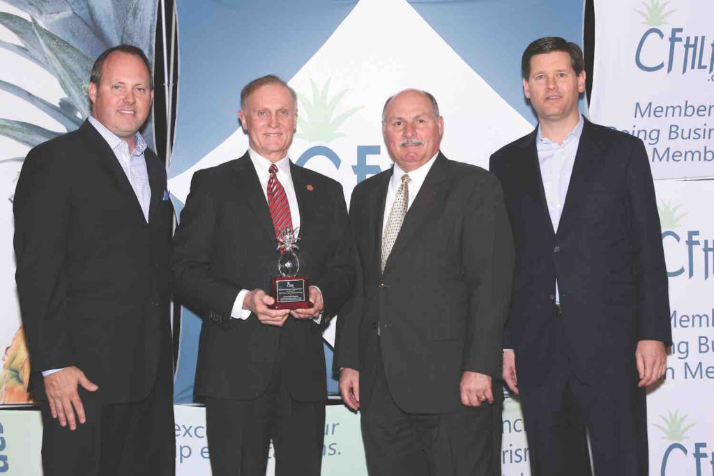 Scott Tripoli, General Manager of the DoubleTree by Hilton Orlando at SeaWorld, Jeff Brinda of the Crowne Plaza Orlando – Lake Buena Vista and Doug Gehret, General Manager of the Hilton Orlando present Senator David Simmons with the 2013 Public Servant of the Year Award.