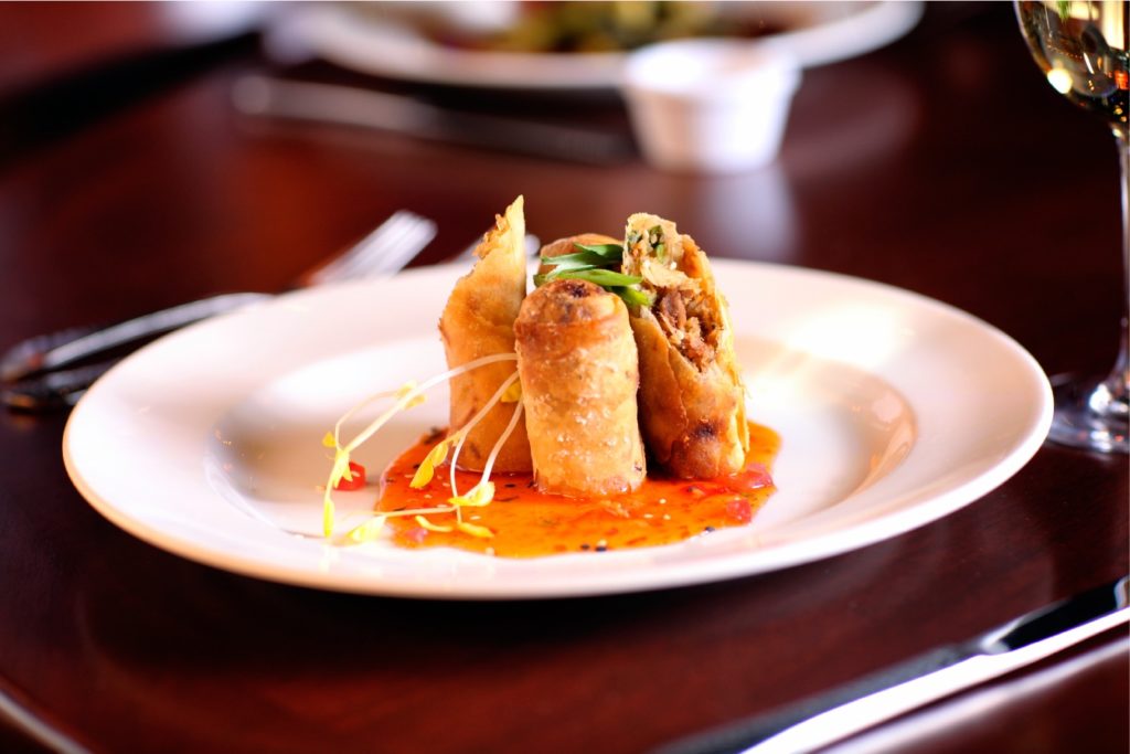 Kahlua Chicken Eggrolls with orange chili dipping sauce at Emeril’s Tchoup Chop.