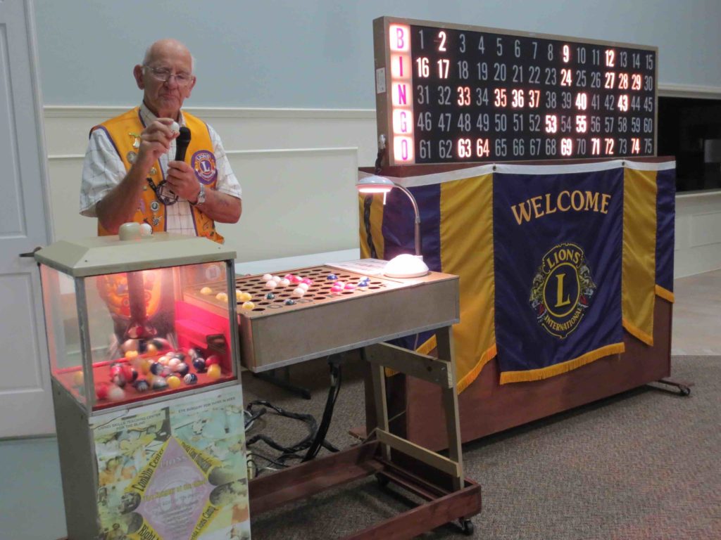 Soft spoken Lions Club Bingo Chairman Tom Conaughty calling numbers.