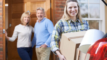 parents smiling as their kid heads off to college