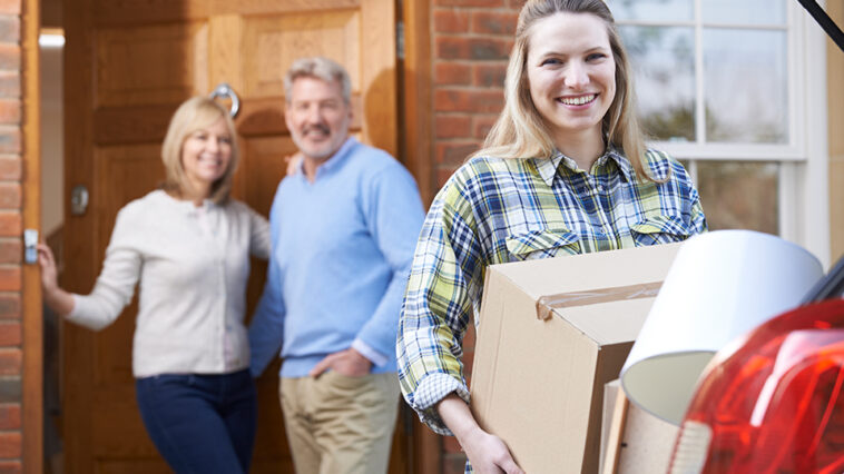 parents smiling as their kid heads off to college