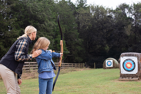 mom and daughter enjoying archery at Barnsley Resort