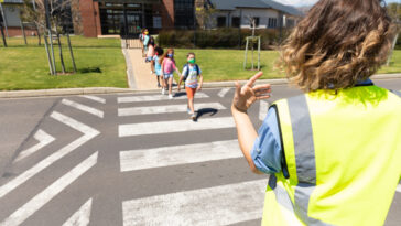 school kids crossing the street. promoting school safety.
