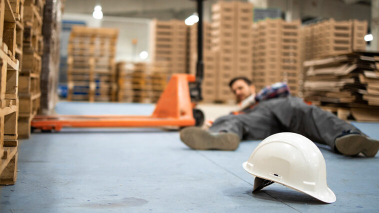 photo of man laying on the ground after a slip and fall accident