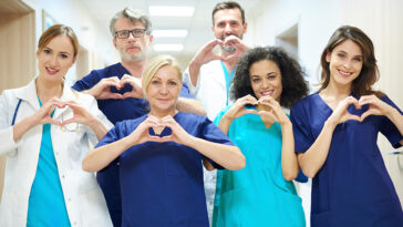 doctors throwing up heart signs