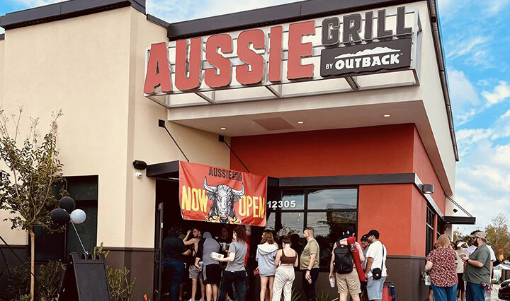 photo of people lined up outside of Aussie Grill Waterford Lakes for the grand opening