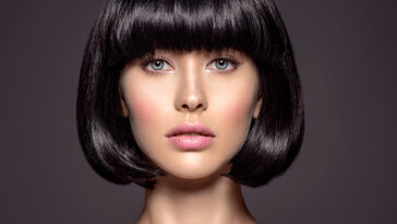 Woman with beauty short black hair. winter hair trend.