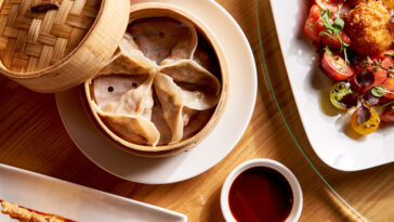 Steamed dumplings lay on a table