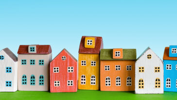 Various color houses demonstrating the growing trends of real estate.