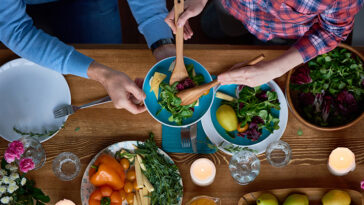 Friends passing around food to create meals.