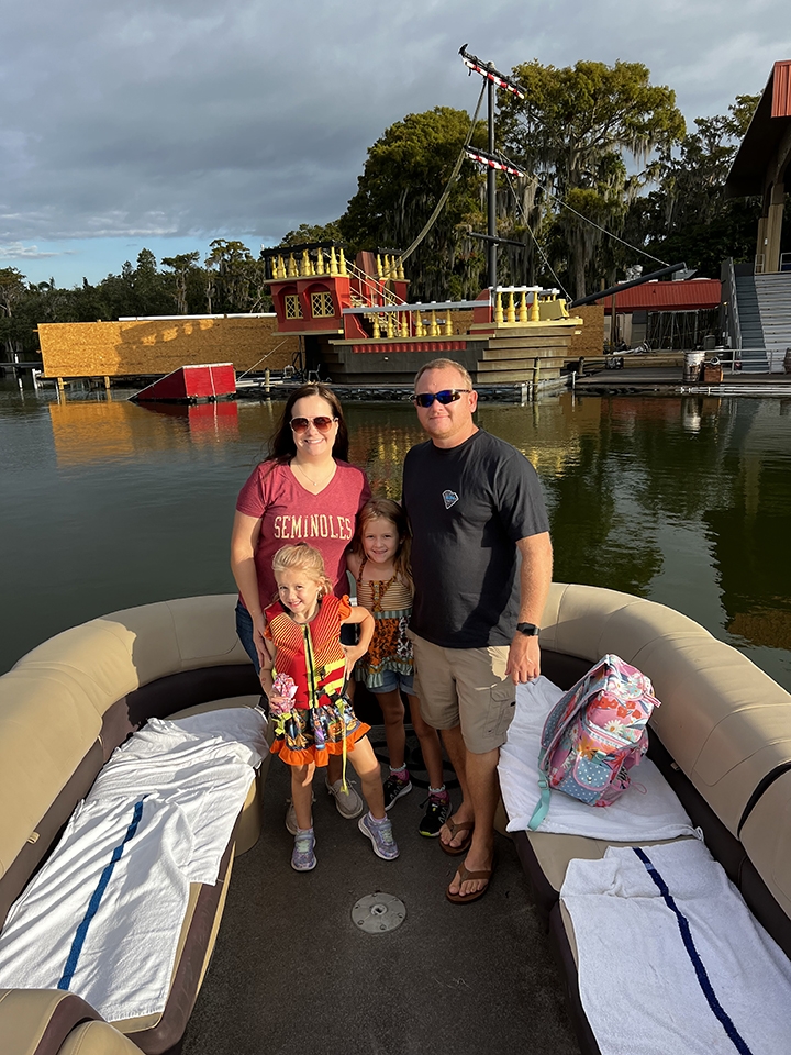 Photo of Candice Postal with her husband and two kids.