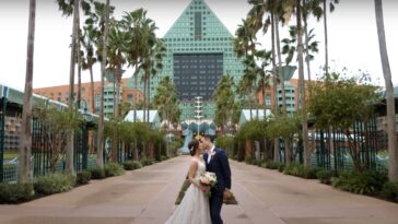 photo of a couple kissing after they just got married at Disney and are now about to go on their honeymoon.