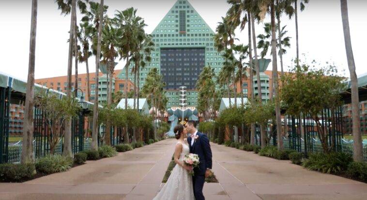 photo of a couple kissing after they just got married at Disney and are now about to go on their honeymoon.