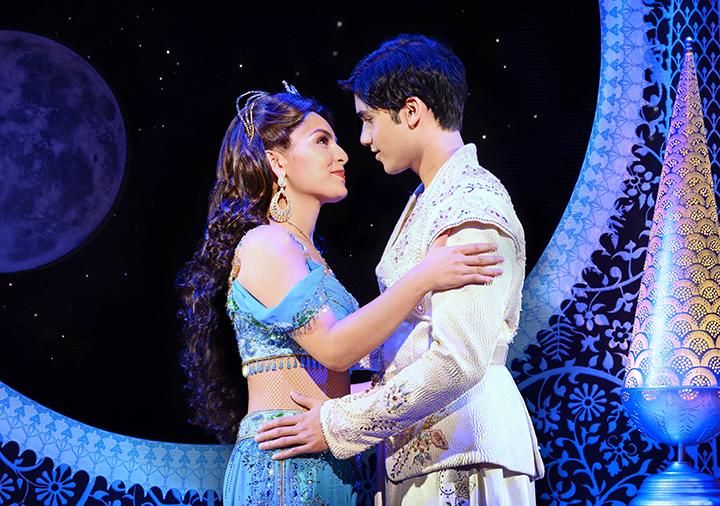 Aladdin and Jasmine wrapped in each other's arms.