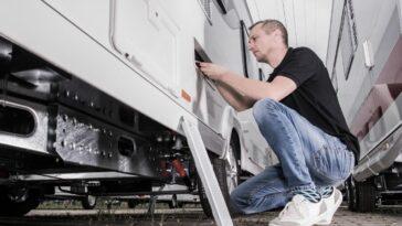 man working on RV