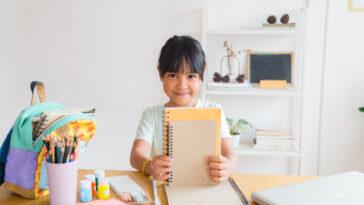 little girl with notebooks