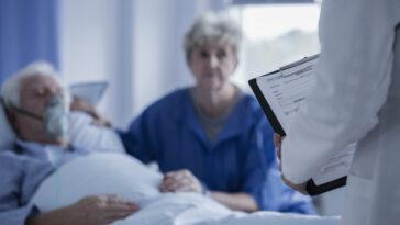 man in hospital bed