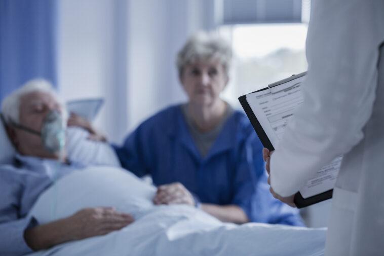 man in hospital bed