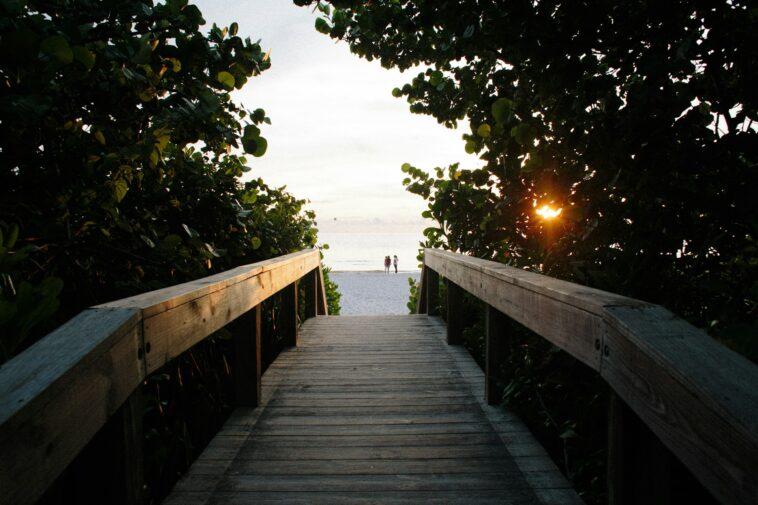 A bridge facing a beach in Naples, one of the sober-friendly travel destinations in Florida 