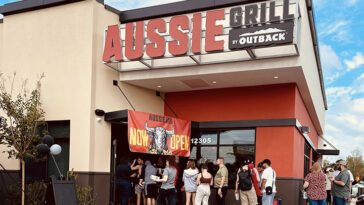 photo of people lined up outside of Aussie Grill Waterford Lakes for the grand opening