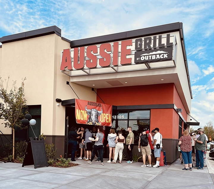 photo of people lined up outside of Aussie Grill Waterford Lakes for the grand opening